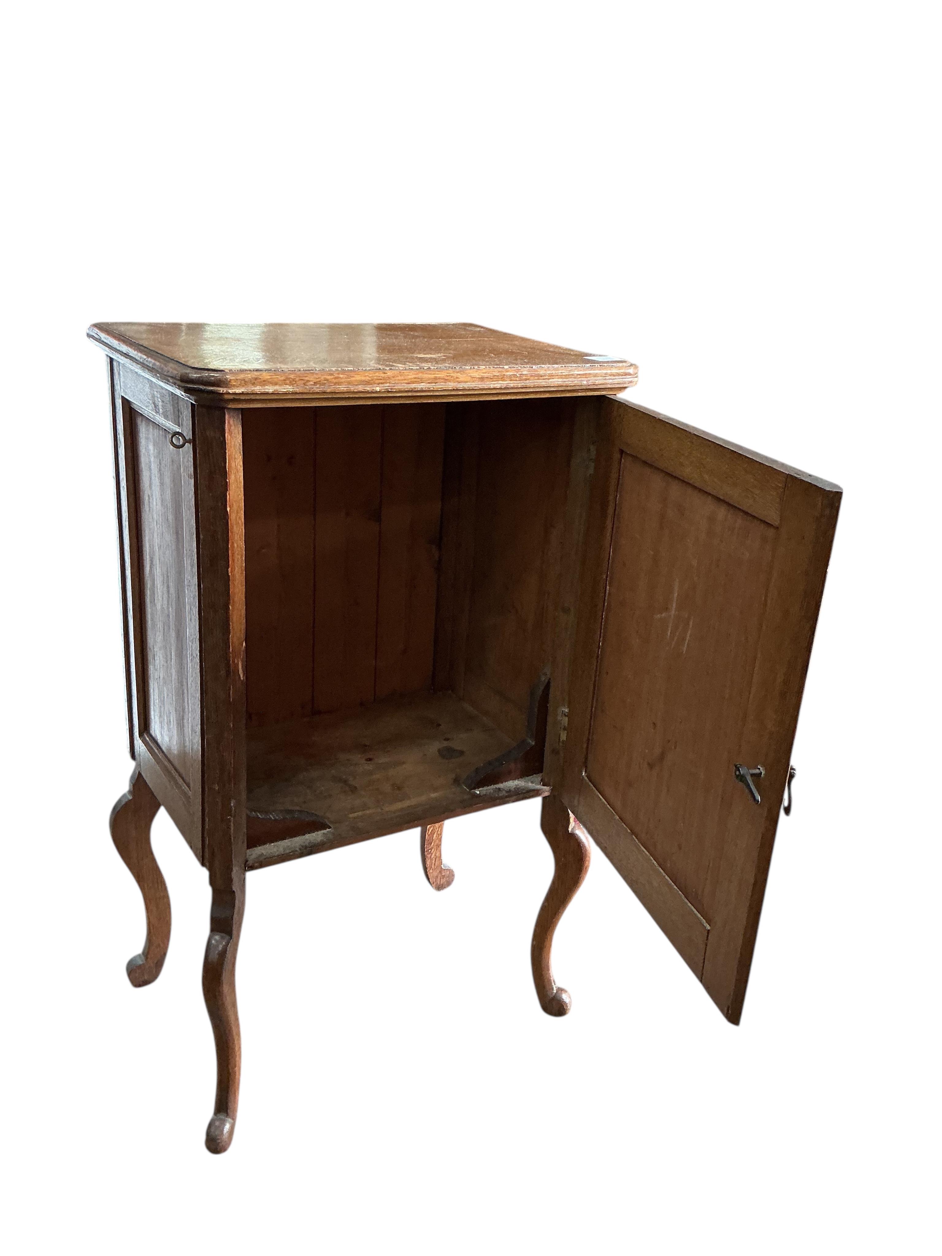 A 19th century French oak side cabinet, width 54cm, depth 38cm, height 94cm